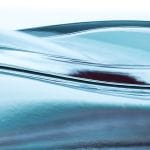 The surface of clear blue water in motion.