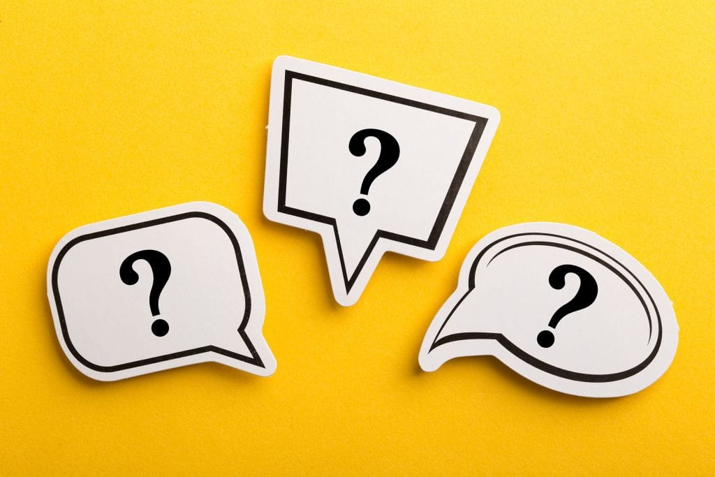 Three speech-bubble shapes with question marks on a bright yellow background