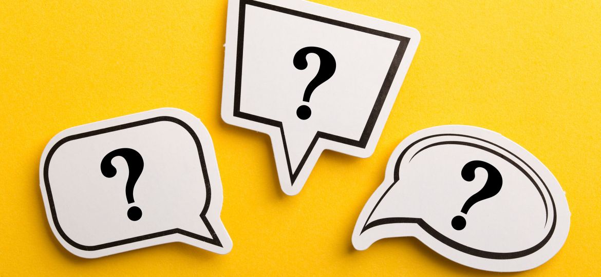 Three speech-bubble shapes with question marks on a bright yellow background